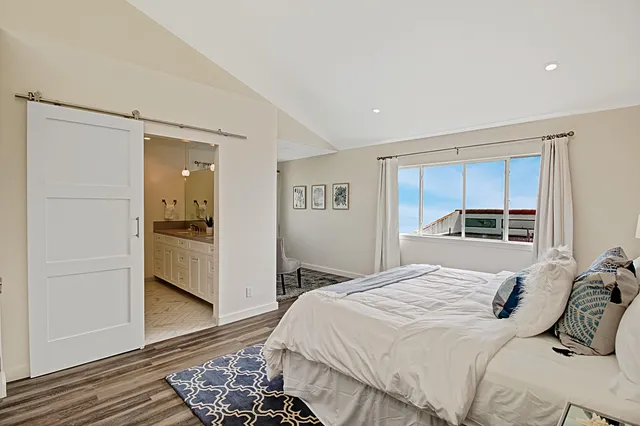 a bathroom with double sink and a mirror