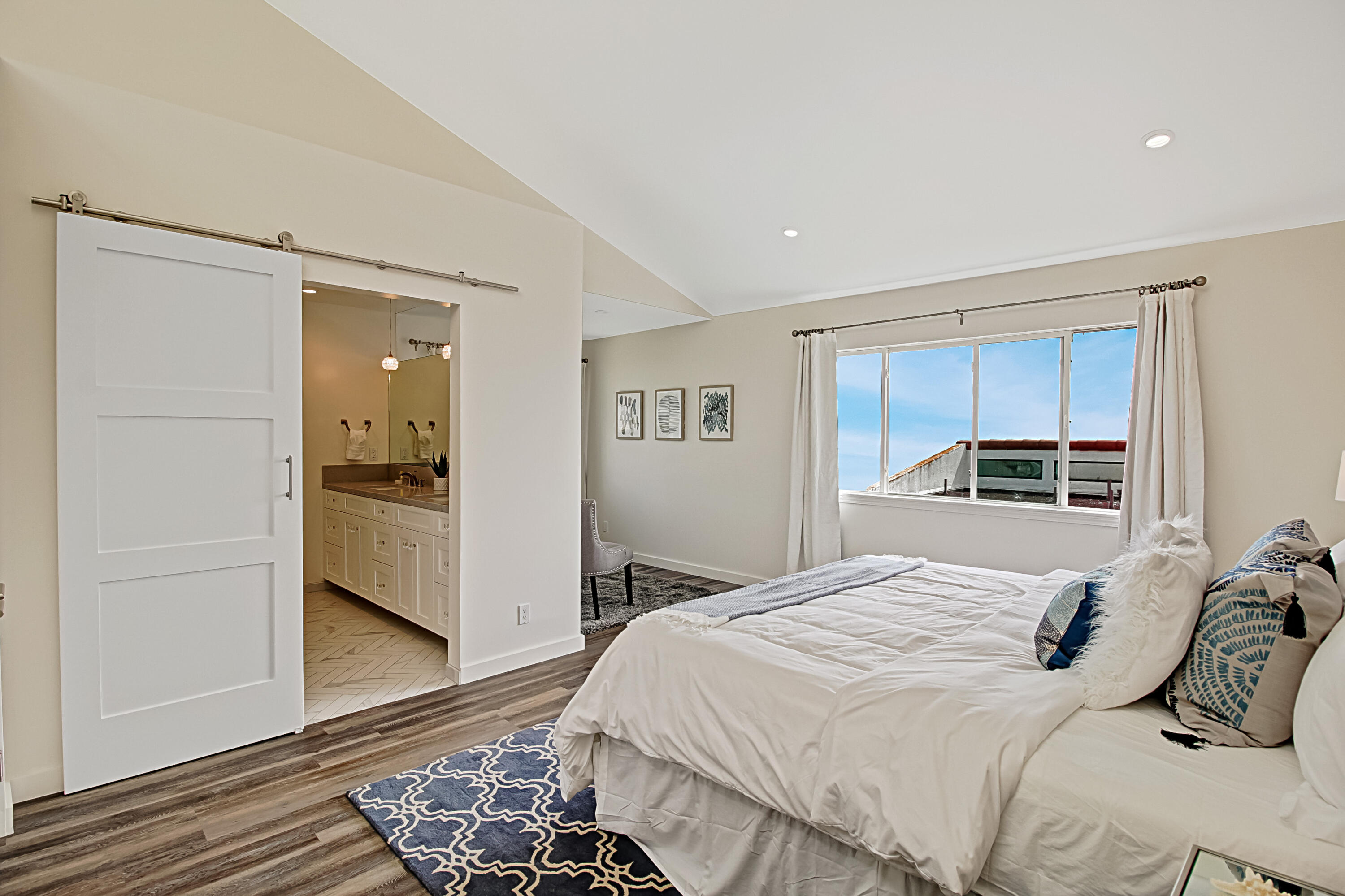 Undisclosed Address Santa Barbara, CA 93109 - Photo 14 of 16 a bedroom with a bed and a refrigerator