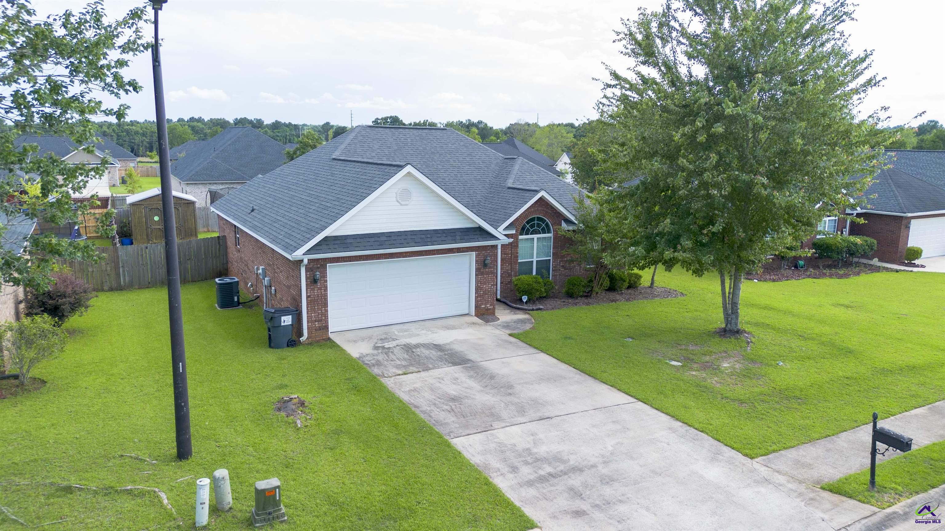 311 Sugarloaf Parkway Perry, GA 31069 - Photo 1 of 31 a front view of a house with garden