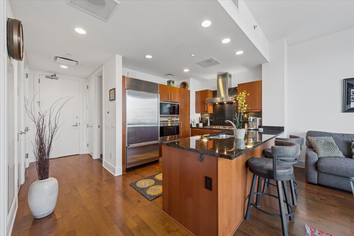 401 North Wabash Avenue, Unit 37I Chicago, IL 60611 - Photo 14 of 40 a kitchen with stainless steel appliances granite countertop a refrigerator and a stove top oven