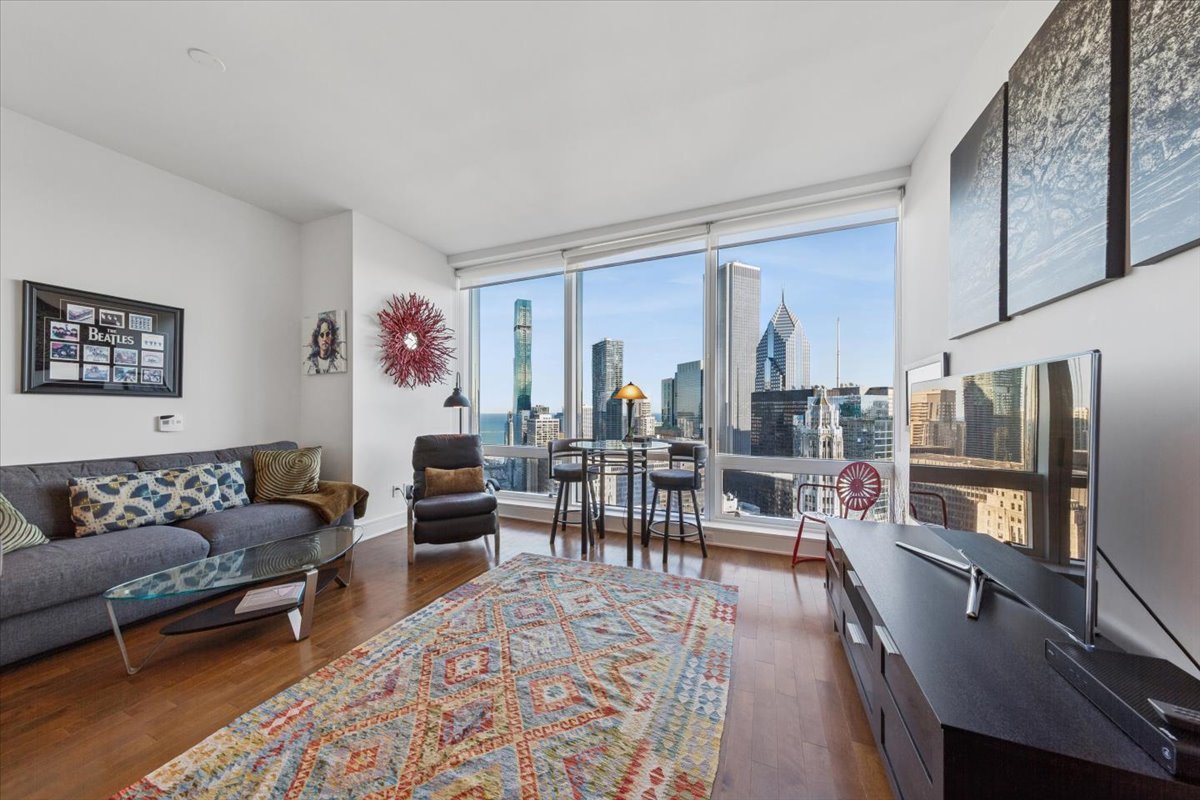 401 North Wabash Avenue, Unit 37I Chicago, IL 60611 - Photo 17 of 40 a living room with furniture and wooden floor