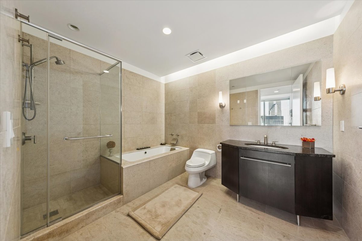 401 North Wabash Avenue, Unit 37I Chicago, IL 60611 - Photo 20 of 40 a bathroom with a sink a toilet and shower
