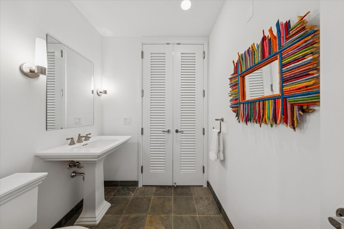 401 North Wabash Avenue, Unit 37I Chicago, IL 60611 - Photo 22 of 40 a bathroom with a sink a toilet and shower