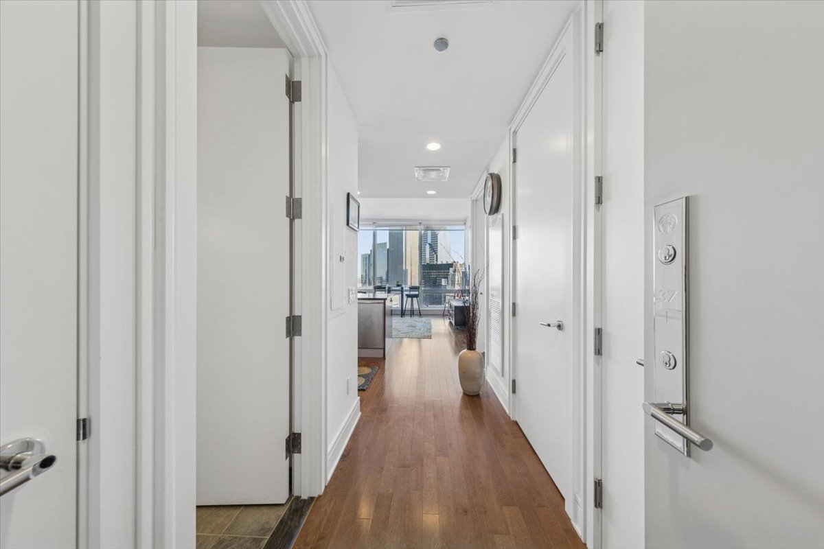 401 North Wabash Avenue, Unit 37I Chicago, IL 60611 - Photo 3 of 40 a view of a hallway with wooden floor