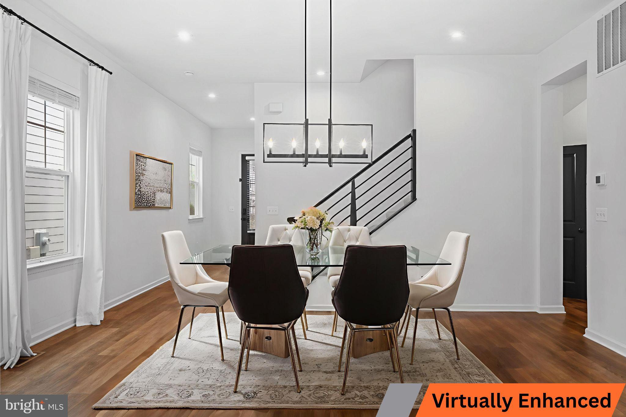 18080 Moss Garden Road Dumfries, VA 22026 - Photo 12 of 76 a view of a dining room with furniture a rug and wooden floor