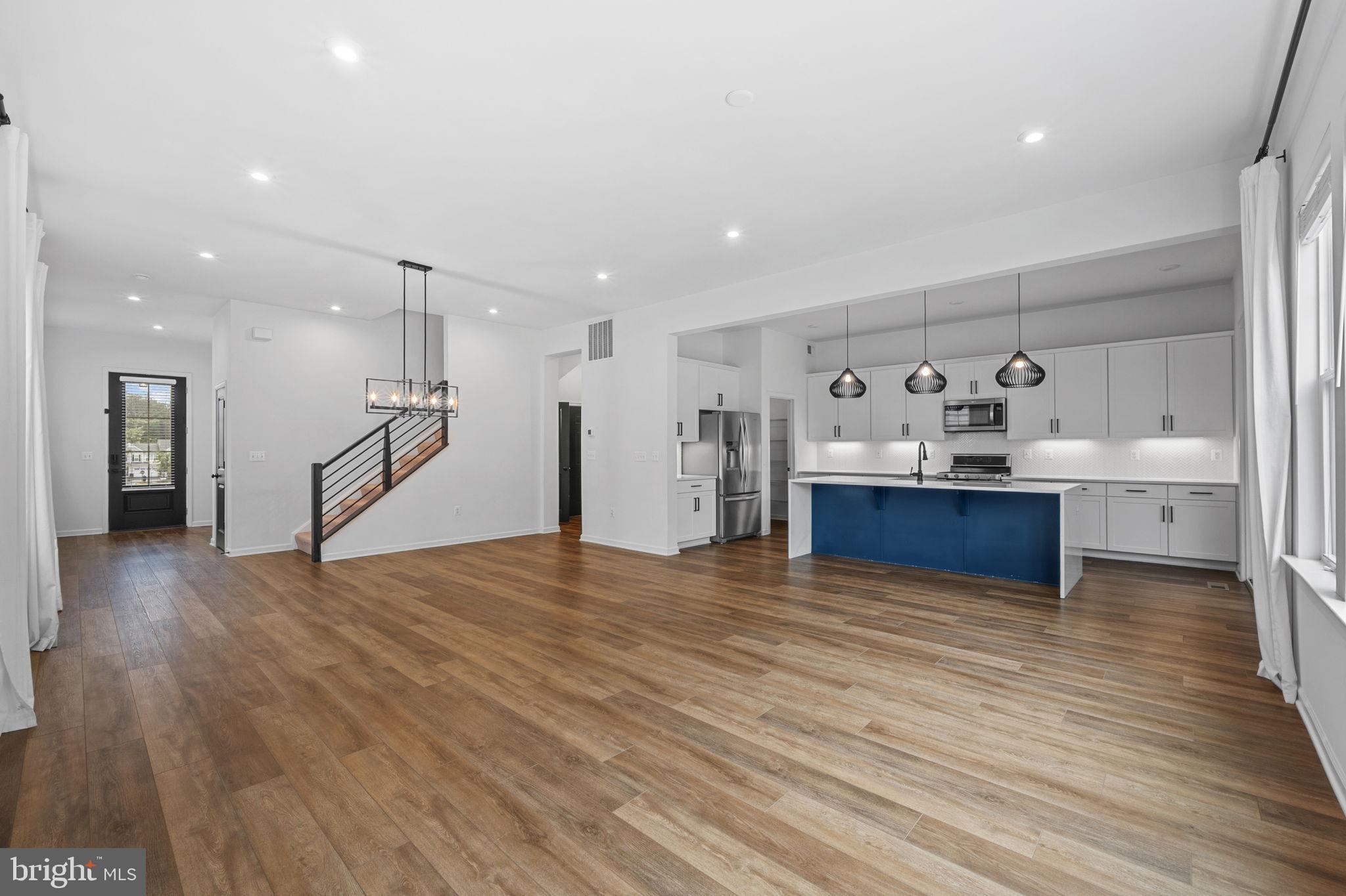 18080 Moss Garden Road Dumfries, VA 22026 - Photo 16 of 76 a view of kitchen with refrigerator and wooden floor