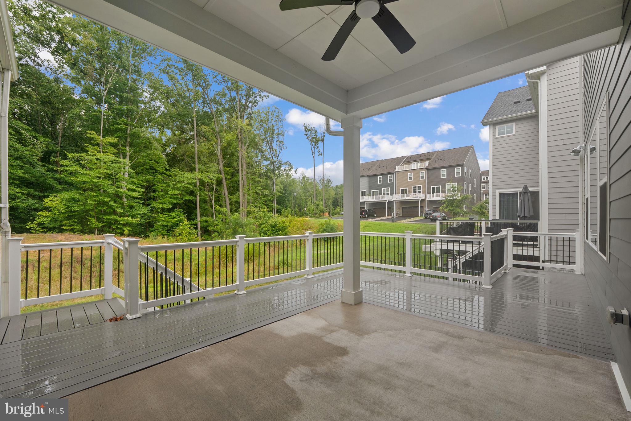 18080 Moss Garden Road Dumfries, VA 22026 - Photo 18 of 76 a view of a porch with furniture and garden view