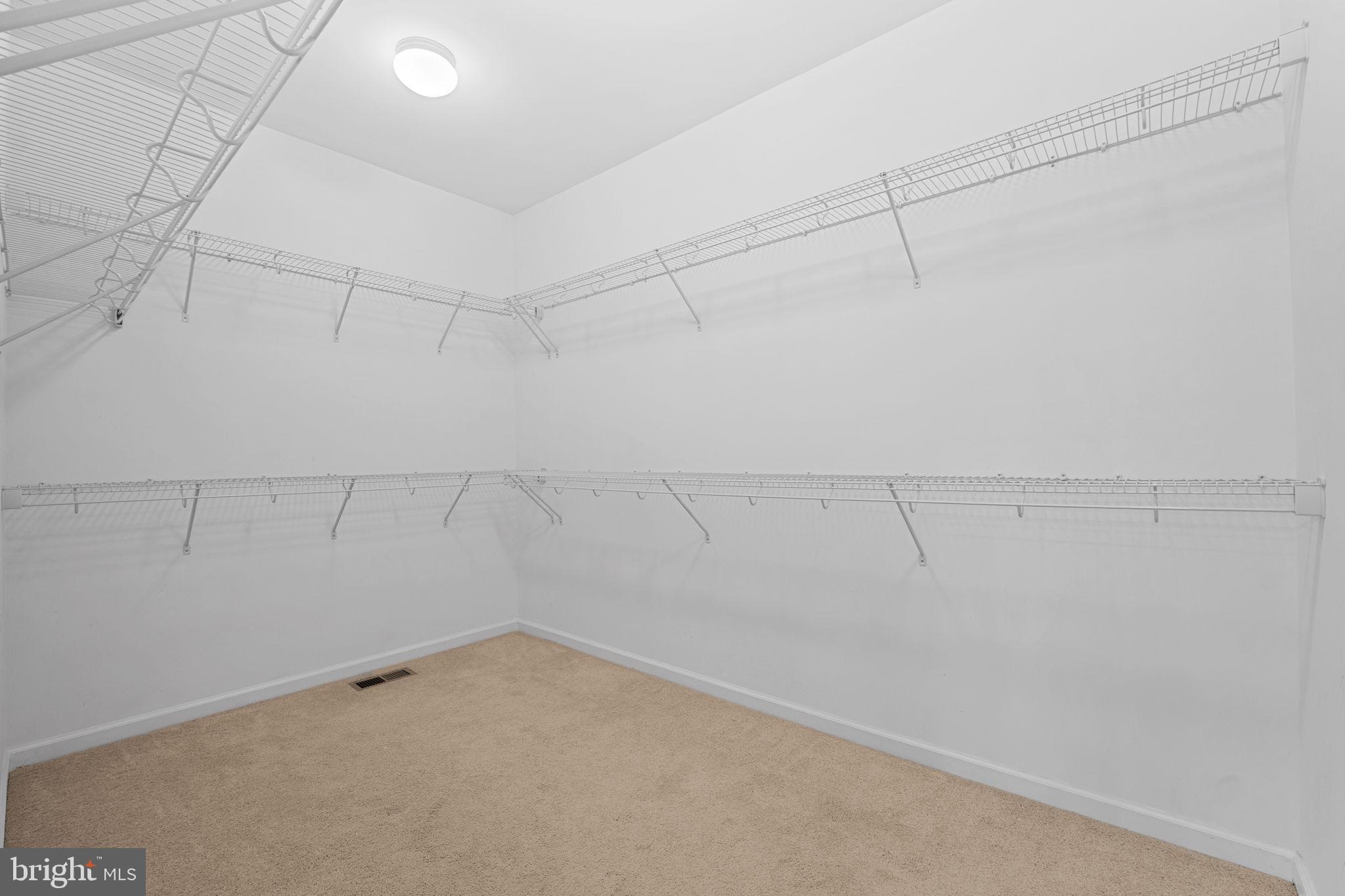 18080 Moss Garden Road Dumfries, VA 22026 - Photo 29 of 76 a view of a room with racks on the wall