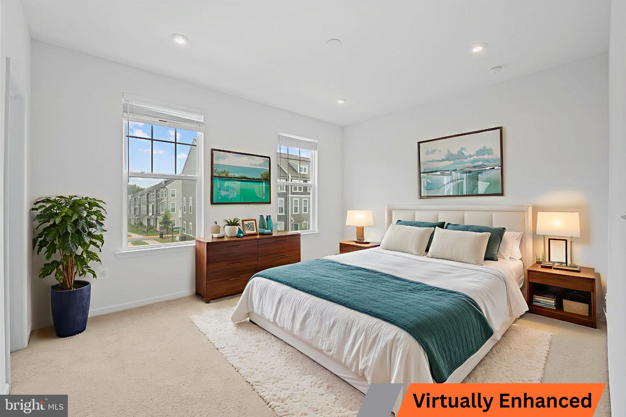 18080 Moss Garden Road Dumfries, VA 22026 - Photo 37 of 76 a bedroom with a bed large window and potted plant