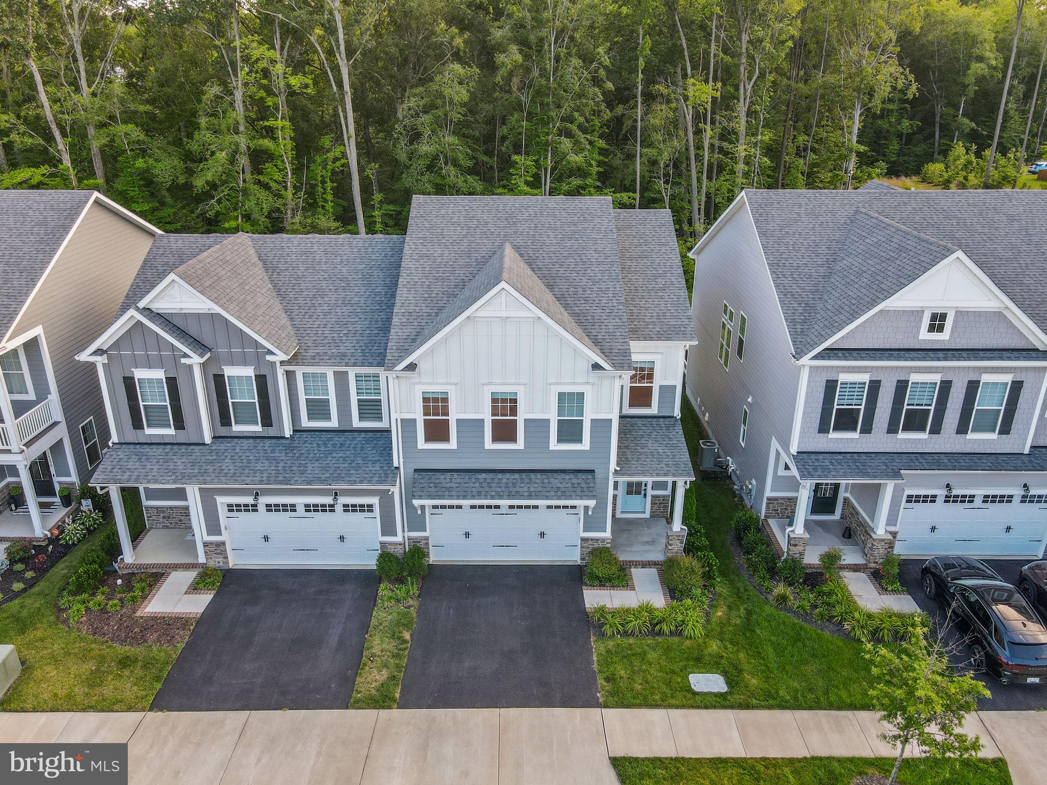 18080 Moss Garden Road Dumfries, VA 22026 - Photo 4 of 76 a aerial view of a brick house next to a yard
