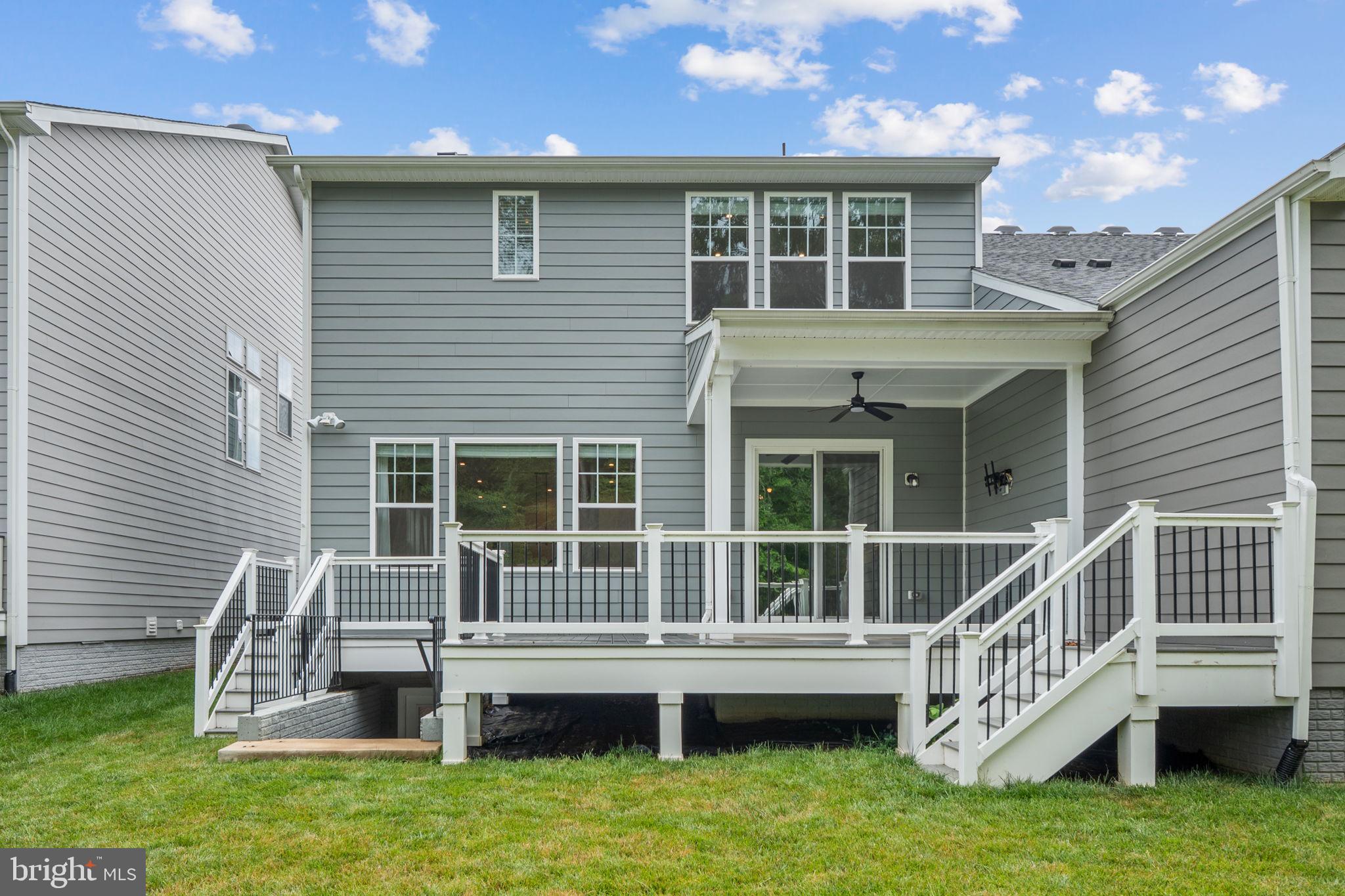 18080 Moss Garden Road Dumfries, VA 22026 - Photo 48 of 76 a view of a house with a roof deck
