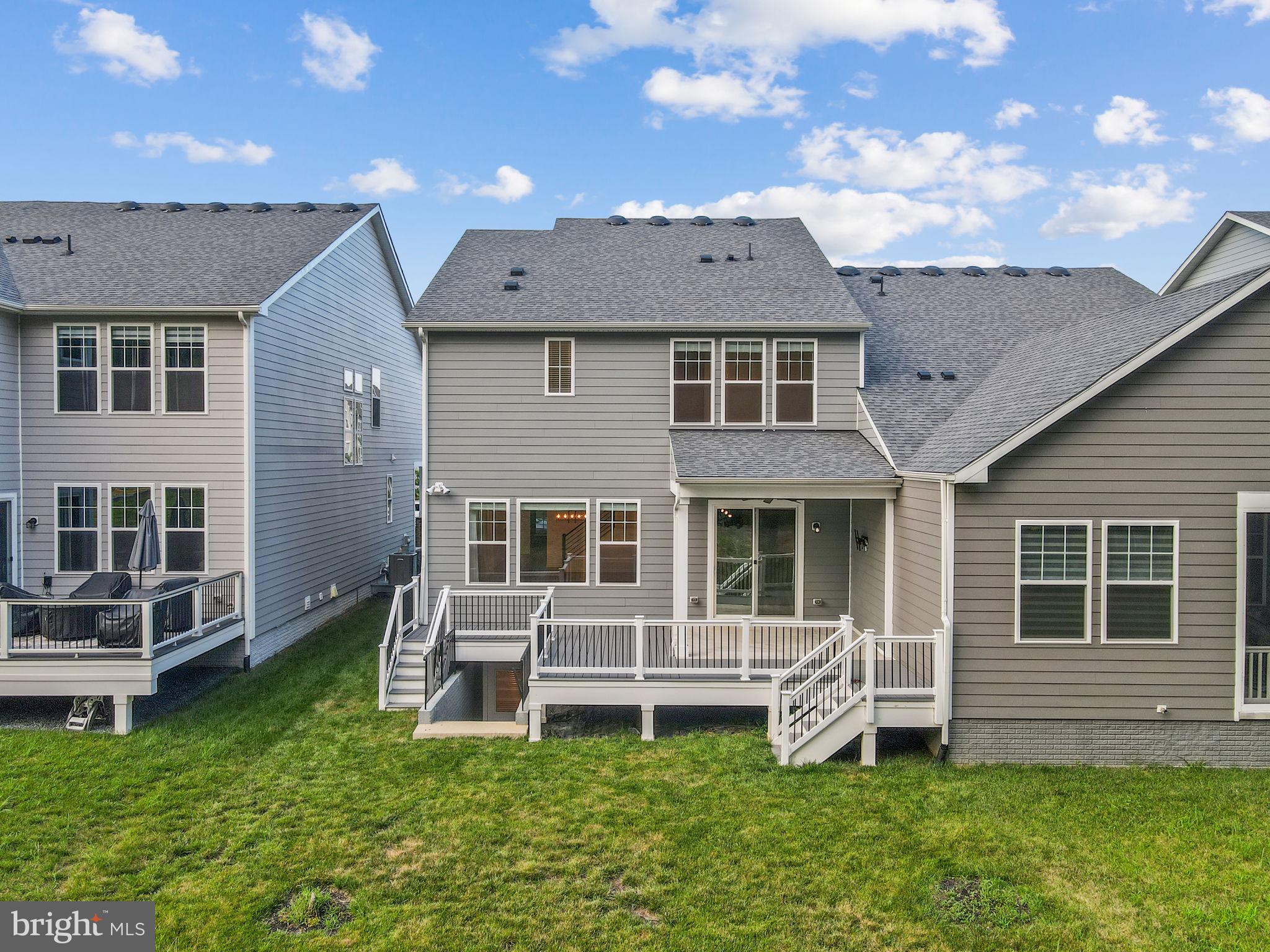 18080 Moss Garden Road Dumfries, VA 22026 - Photo 51 of 76 a front view of a house with a yard