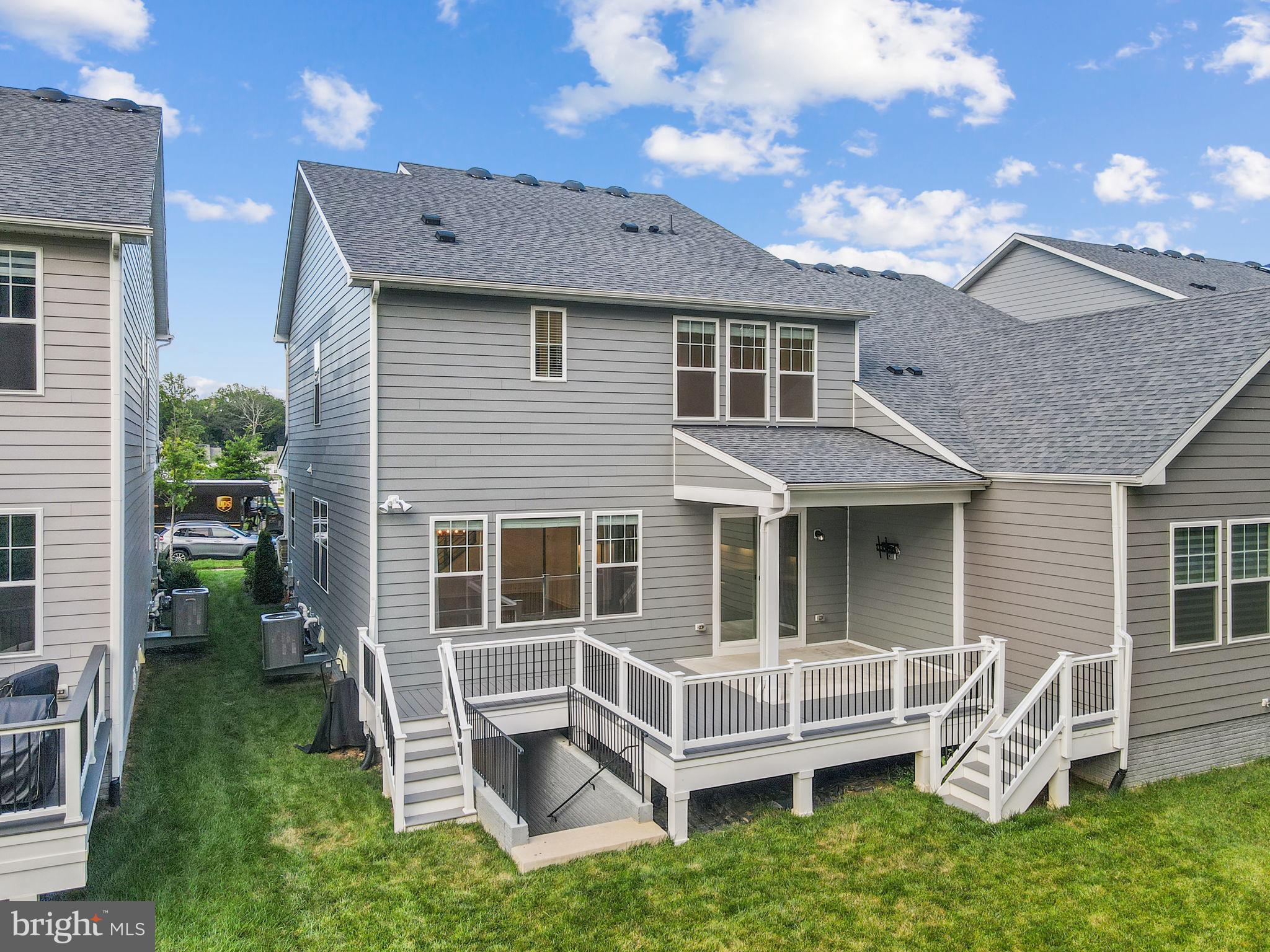 18080 Moss Garden Road Dumfries, VA 22026 - Photo 52 of 76 a view of a house with a yard and wooden fence