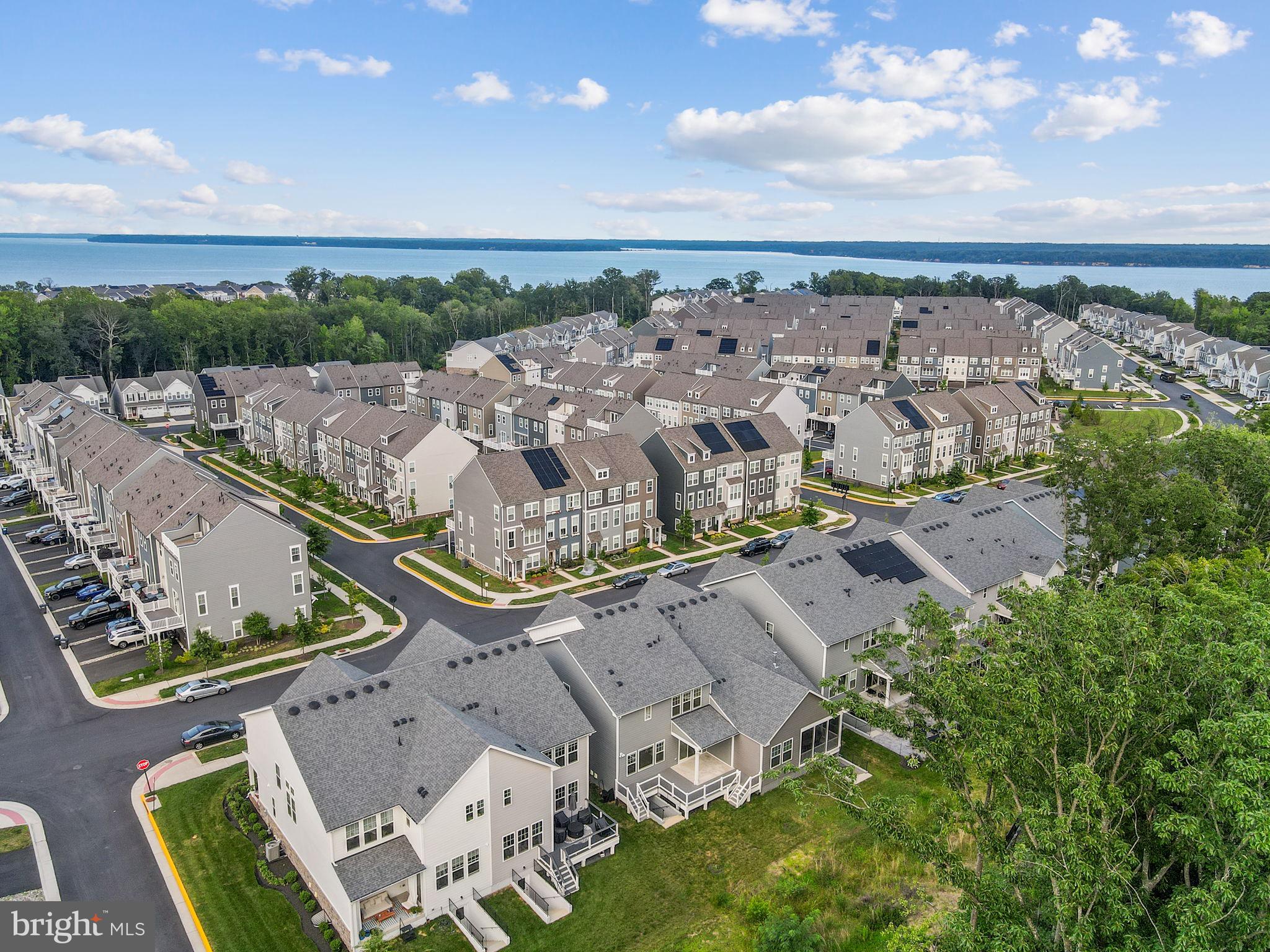 18080 Moss Garden Road Dumfries, VA 22026 - Photo 55 of 76 an aerial view of multiple house with outdoor space