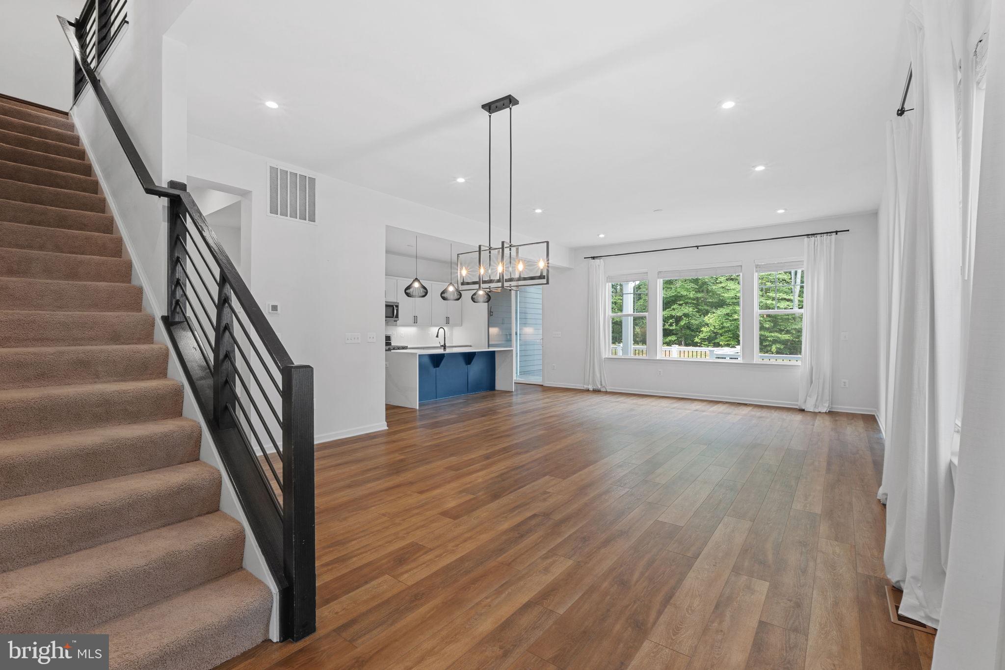 18080 Moss Garden Road Dumfries, VA 22026 - Photo 73 of 76 Gorgeous LVP on this open floor plan main level.