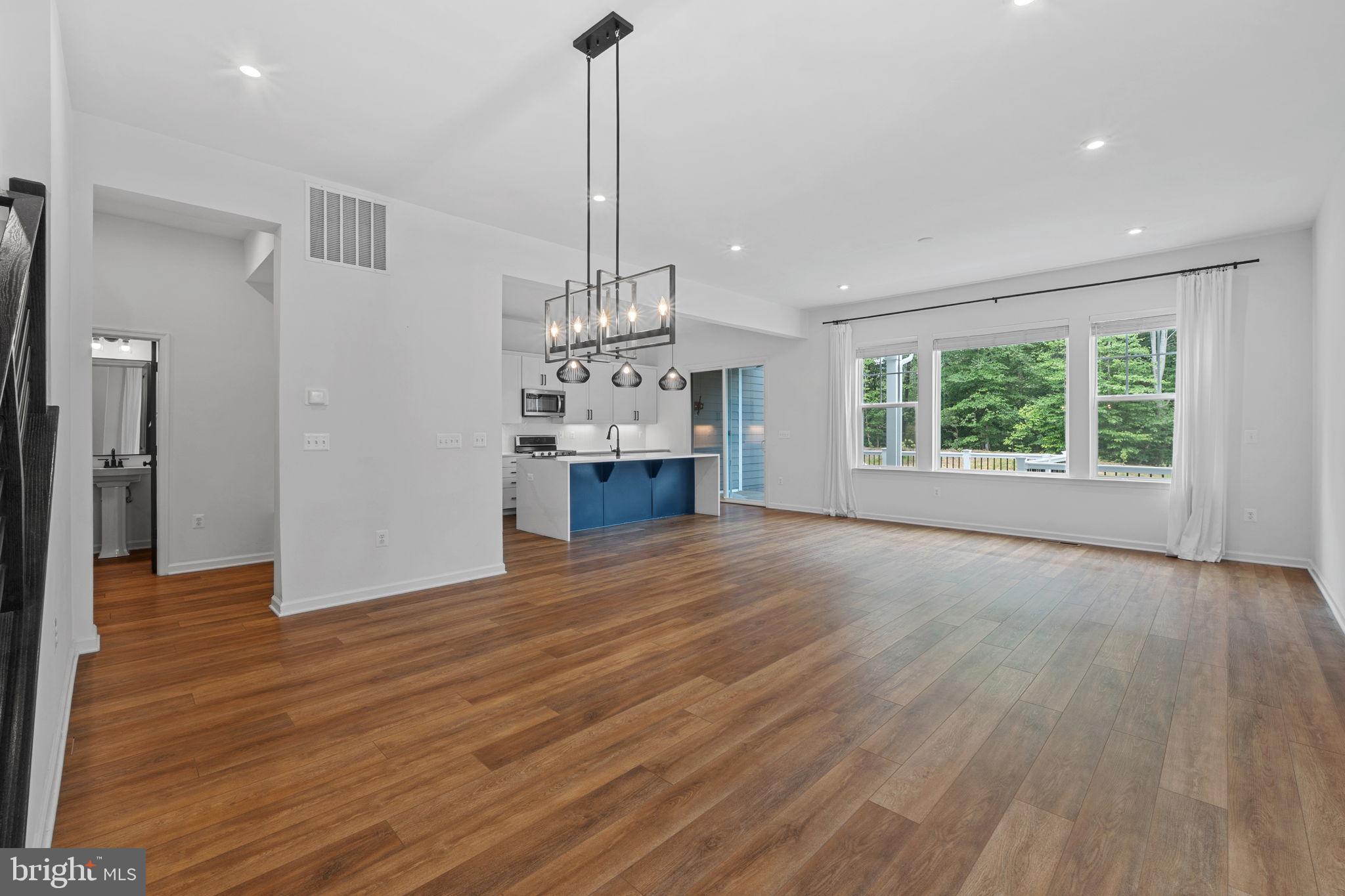 18080 Moss Garden Road Dumfries, VA 22026 - Photo 6 of 76 a view of empty room with wooden floor and windows