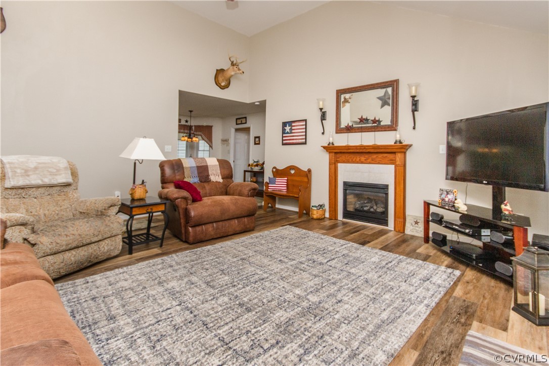 19725 Carson Ruritan Road Carson, VA 23830 - Photo 13 of 36 a living room with furniture a flat screen tv and a fireplace