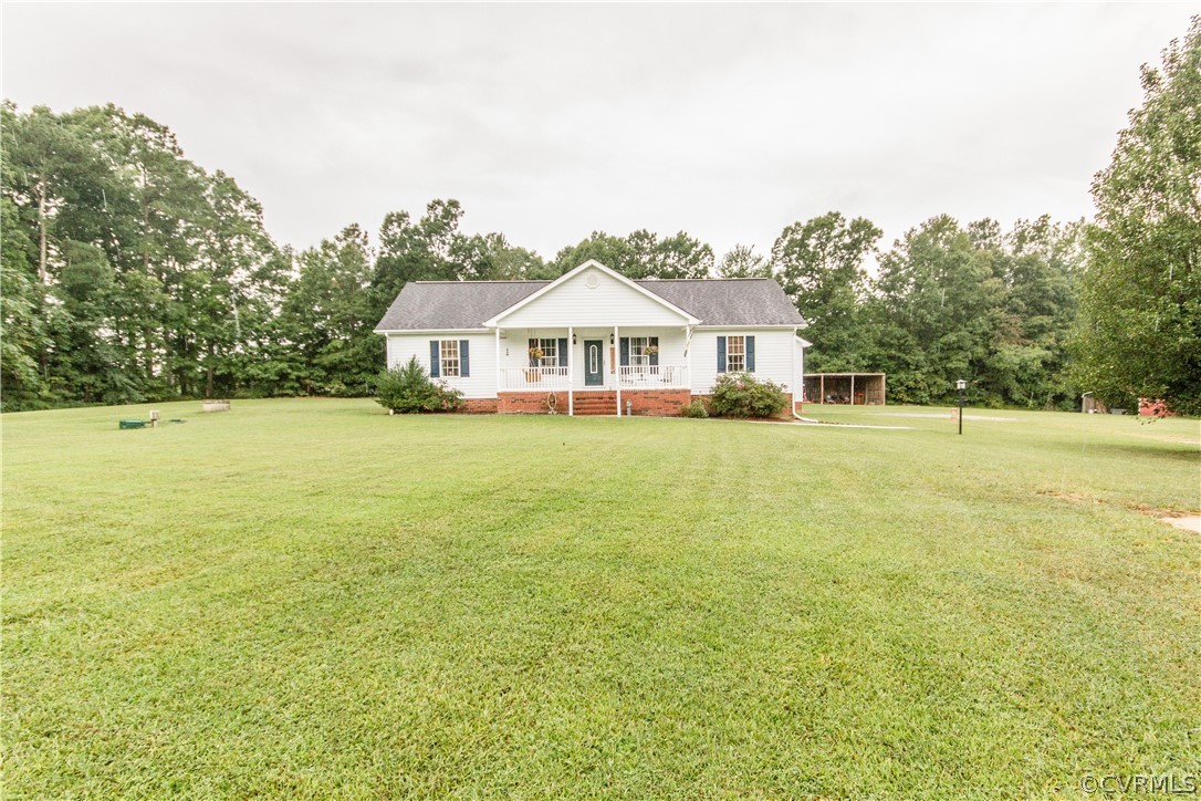 19725 Carson Ruritan Road Carson, VA 23830 - Photo 2 of 36 a front view of a house with a yard