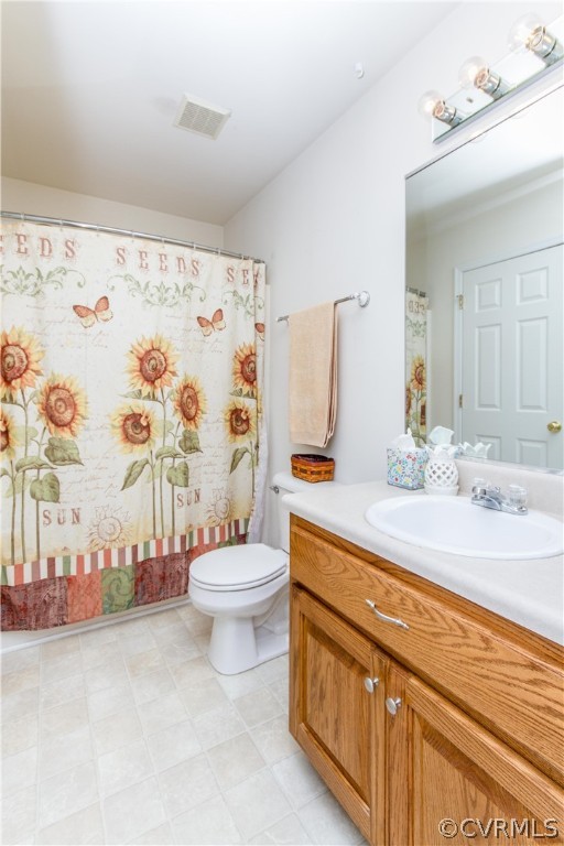 19725 Carson Ruritan Road Carson, VA 23830 - Photo 23 of 36 a bathroom with a granite countertop toilet sink and mirror