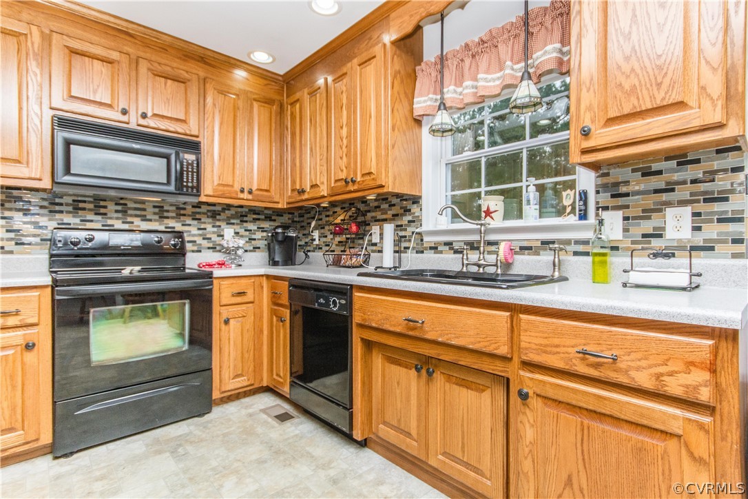 19725 Carson Ruritan Road Carson, VA 23830 - Photo 4 of 36 a kitchen with stainless steel appliances granite countertop a stove and a sink
