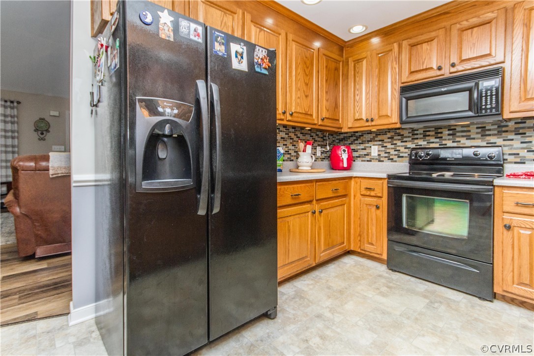 19725 Carson Ruritan Road Carson, VA 23830 - Photo 5 of 36 a kitchen with stainless steel appliances granite countertop a refrigerator and a stove