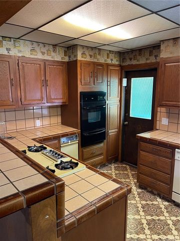 a kitchen with a stove and a refrigerator