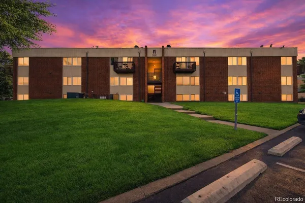 a view of a building with a yard
