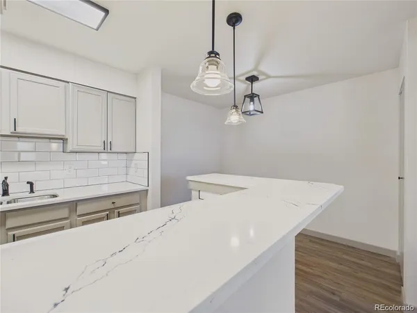 a kitchen with a sink and cabinets