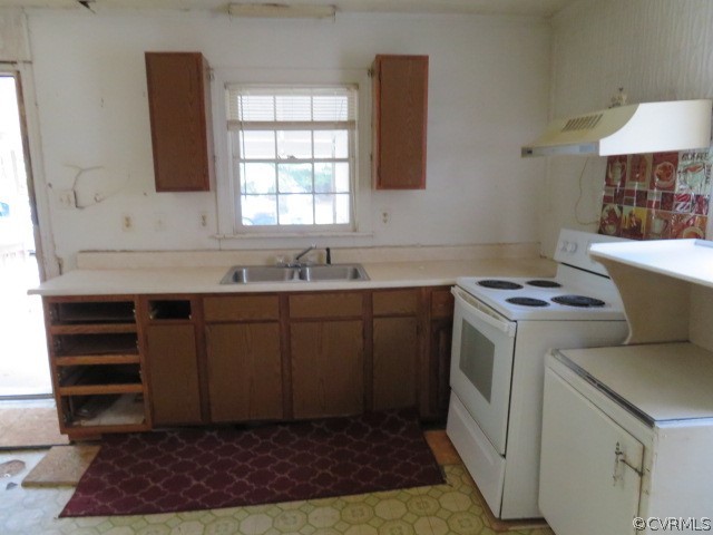 12608 Beach Road Chesterfield, VA 23832 - Photo 26 of 37 a kitchen with a sink cabinets and a window