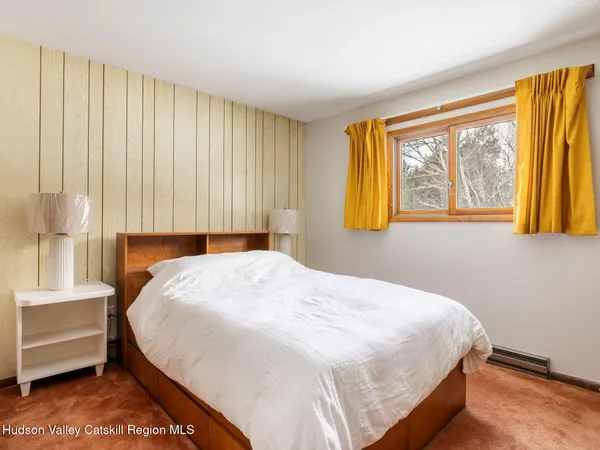 a view of a bedroom with closet and cabinet