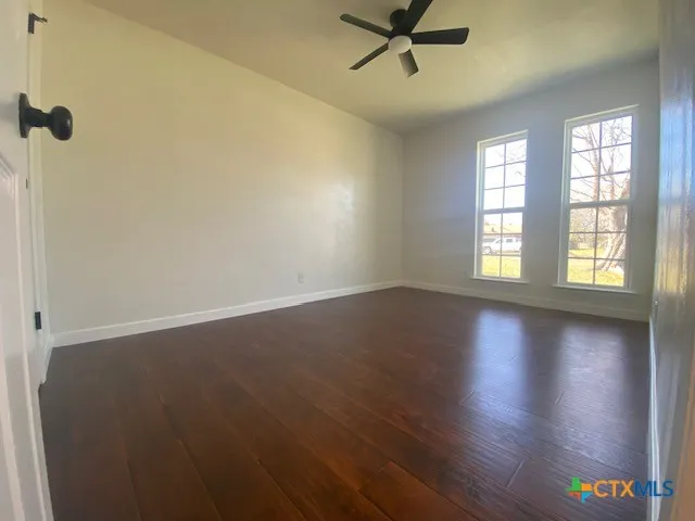 a bathroom with a bathtub a sink a toilet and a mirror