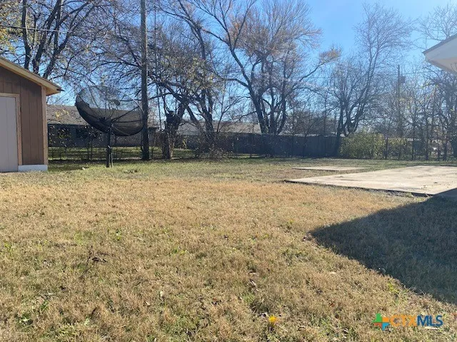 a view of outdoor space with wooden fence