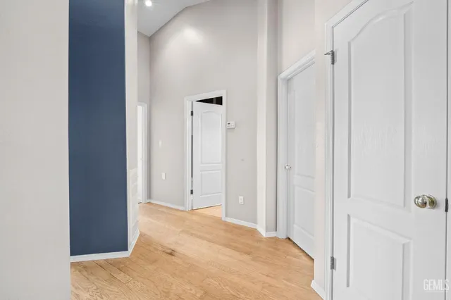 a view of a hallway with a bathroom