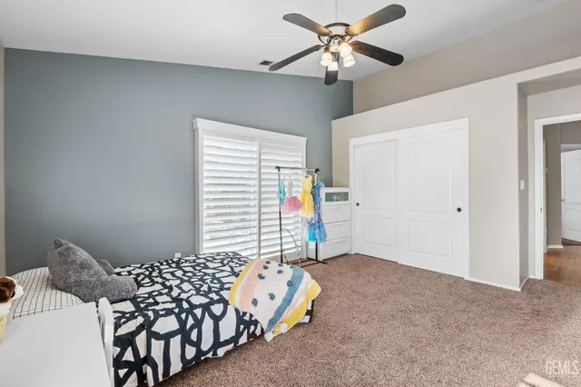 a bedroom with furniture and a chandelier