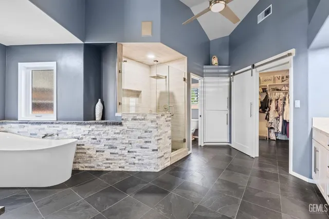 a bathroom with a bathtub and a shower