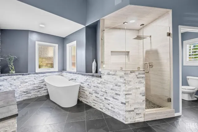 a bathroom with a bathtub sink and toilet