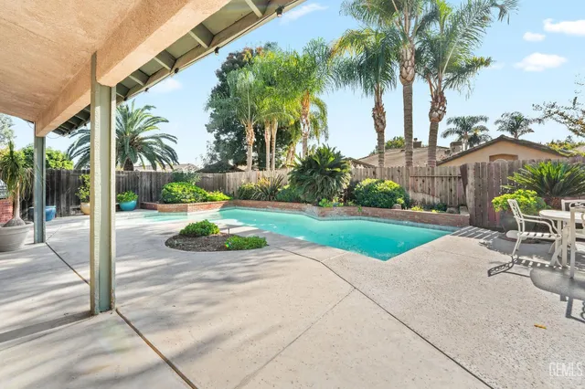 a view of a backyard with a patio