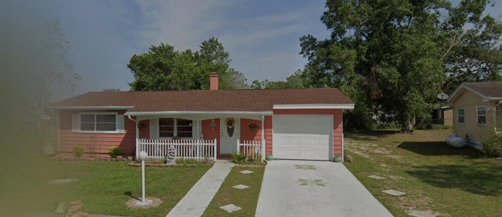 14565 Southwest 35th Terrace Road Ocala, FL 34473 - Photo 1 of 1 front view of a house with a yard