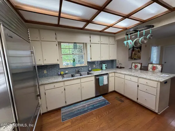 a kitchen with a stove and a microwave