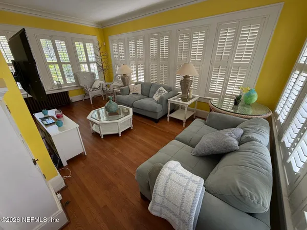 a living room with furniture and a flat screen tv
