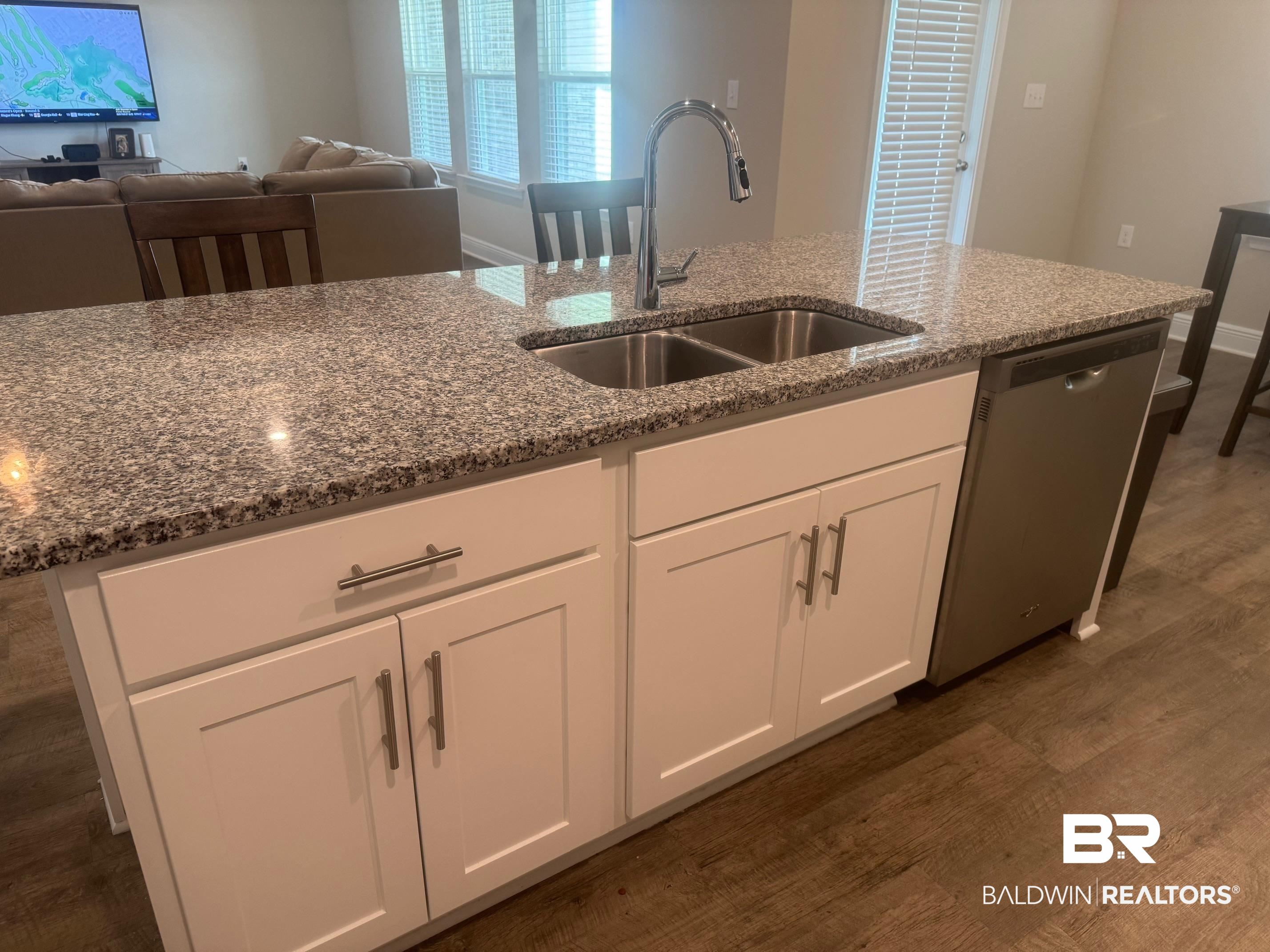 24903 Spectacular Bid Loop Daphne, AL 36526 - Photo 8 of 37 Kitchen with dark wood-type flooring, stone counters, dishwasher, and white cabinets