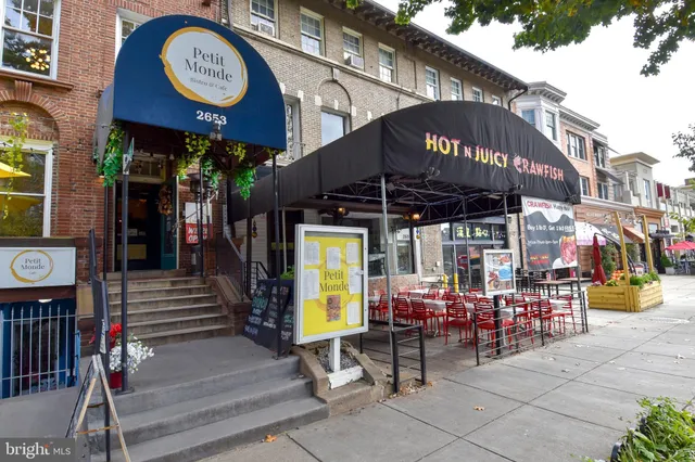 a view of a cafe with table and chairs