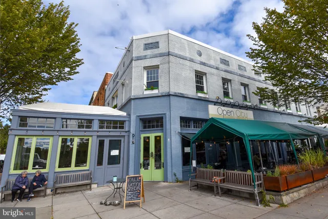a view of a building with glass windows and a table