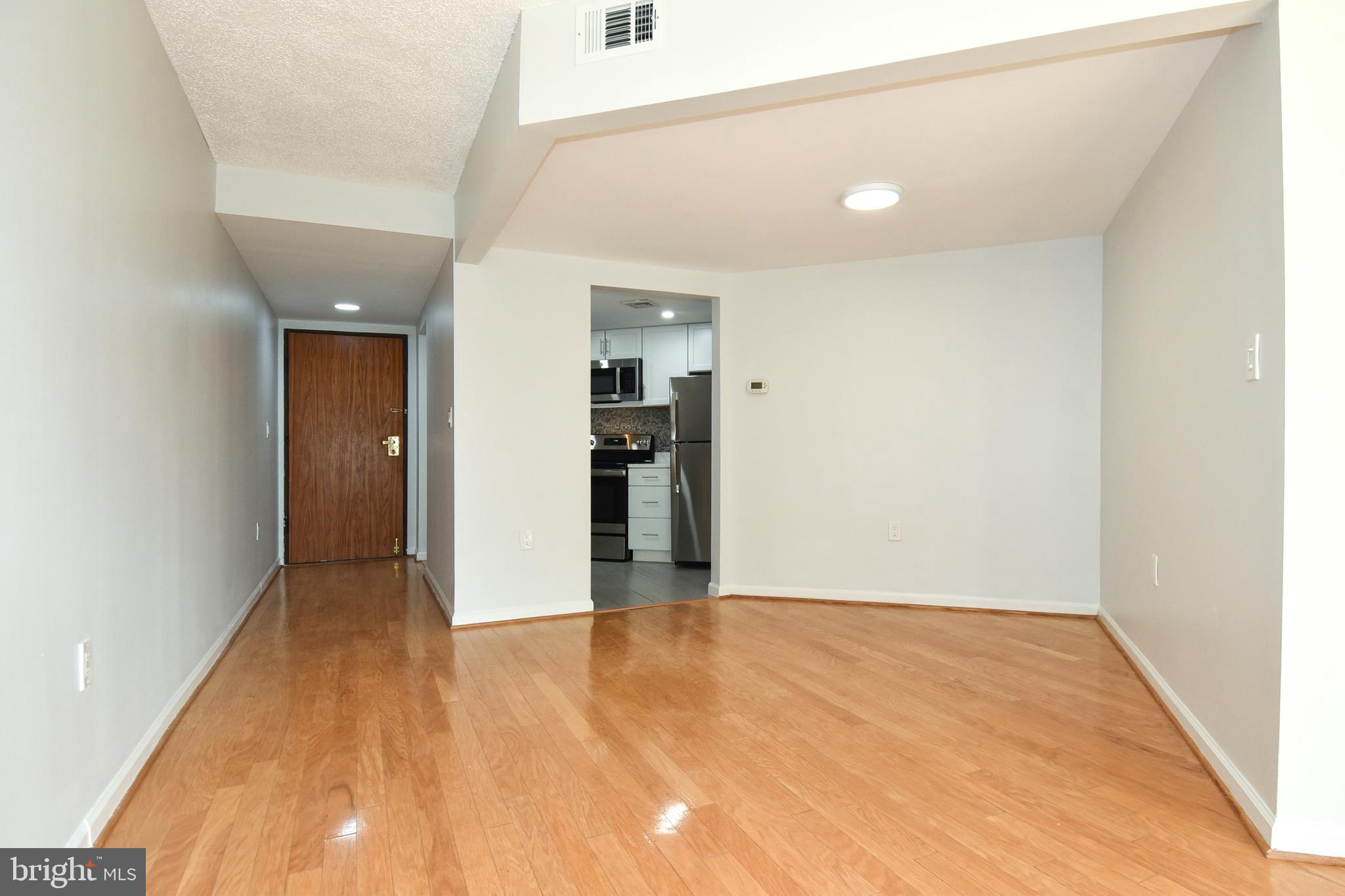2725 Connecticut Avenue Northwest, Unit 403 Washington, DC 20008 - Photo 5 of 25 a view of hallway with wooden floor
