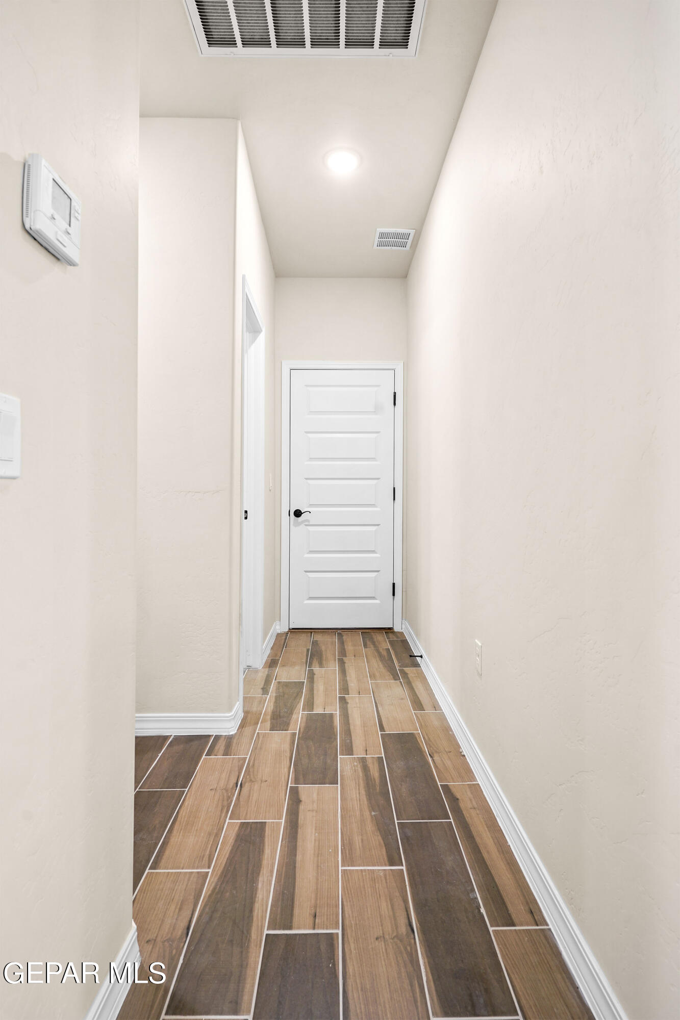 871 Country Club Road, Unit 4E El Paso, TX 79932 - Photo 25 of 34 a view of a room with wooden floor