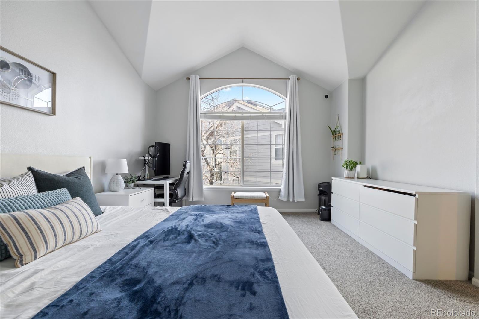 8419 Stonybridge Circle Highlands Ranch, CO 80126 - Photo 13 of 24 a living room with furniture a large window and a chandelier