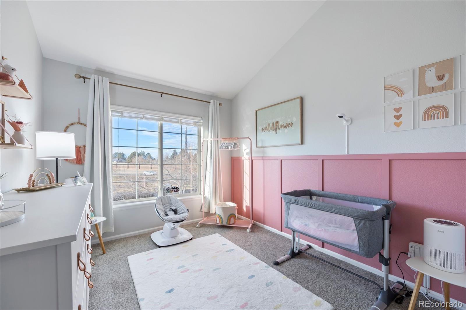 8419 Stonybridge Circle Highlands Ranch, CO 80126 - Photo 17 of 24 a bedroom with furniture and a window