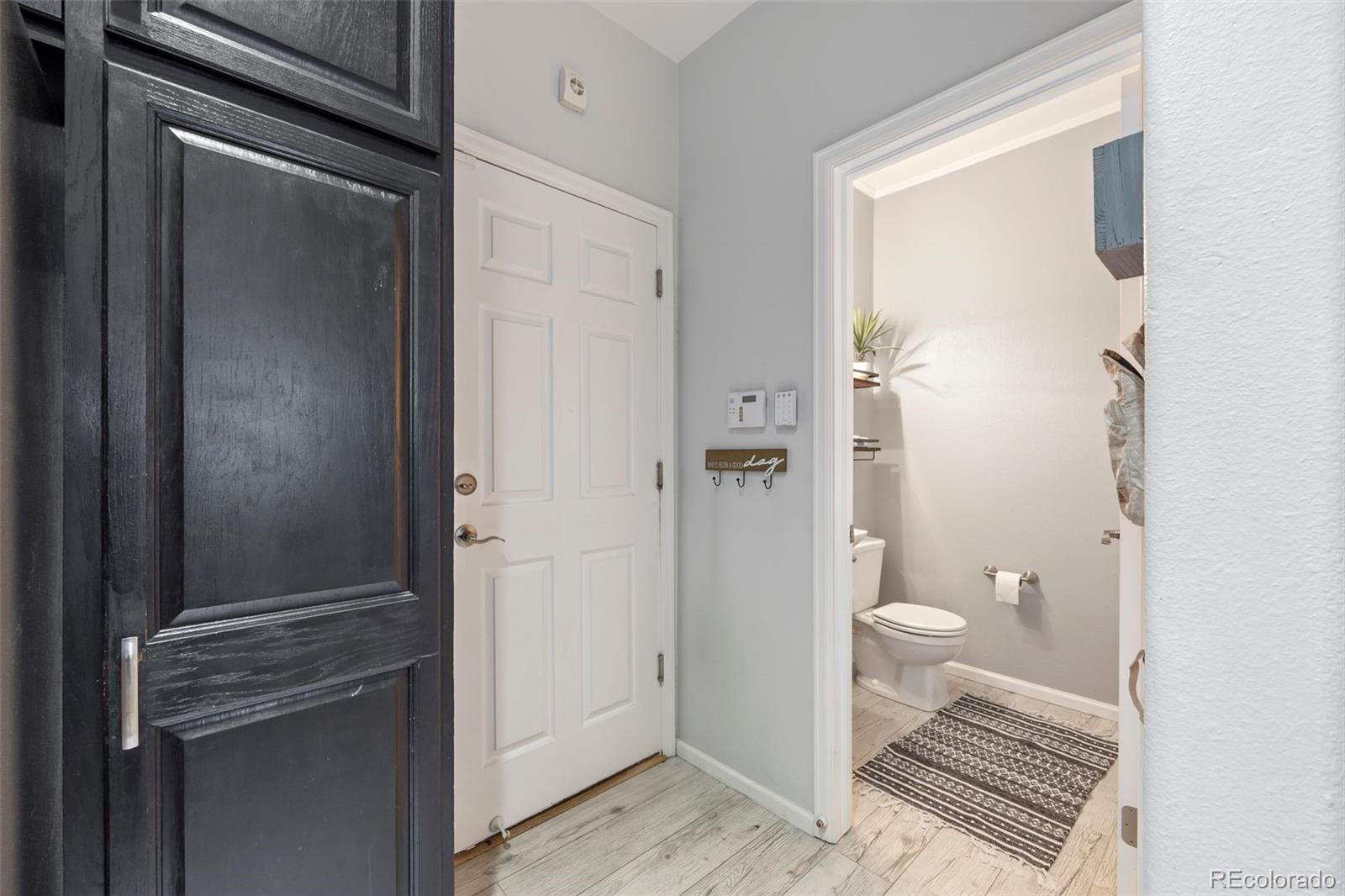 8419 Stonybridge Circle Highlands Ranch, CO 80126 - Photo 20 of 24 a bathroom with a granite countertop shower and a toilet