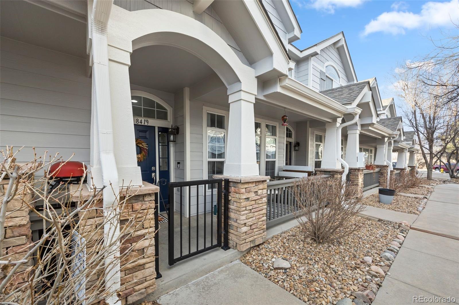 8419 Stonybridge Circle Highlands Ranch, CO 80126 - Photo 2 of 24 front view of a house with a porch