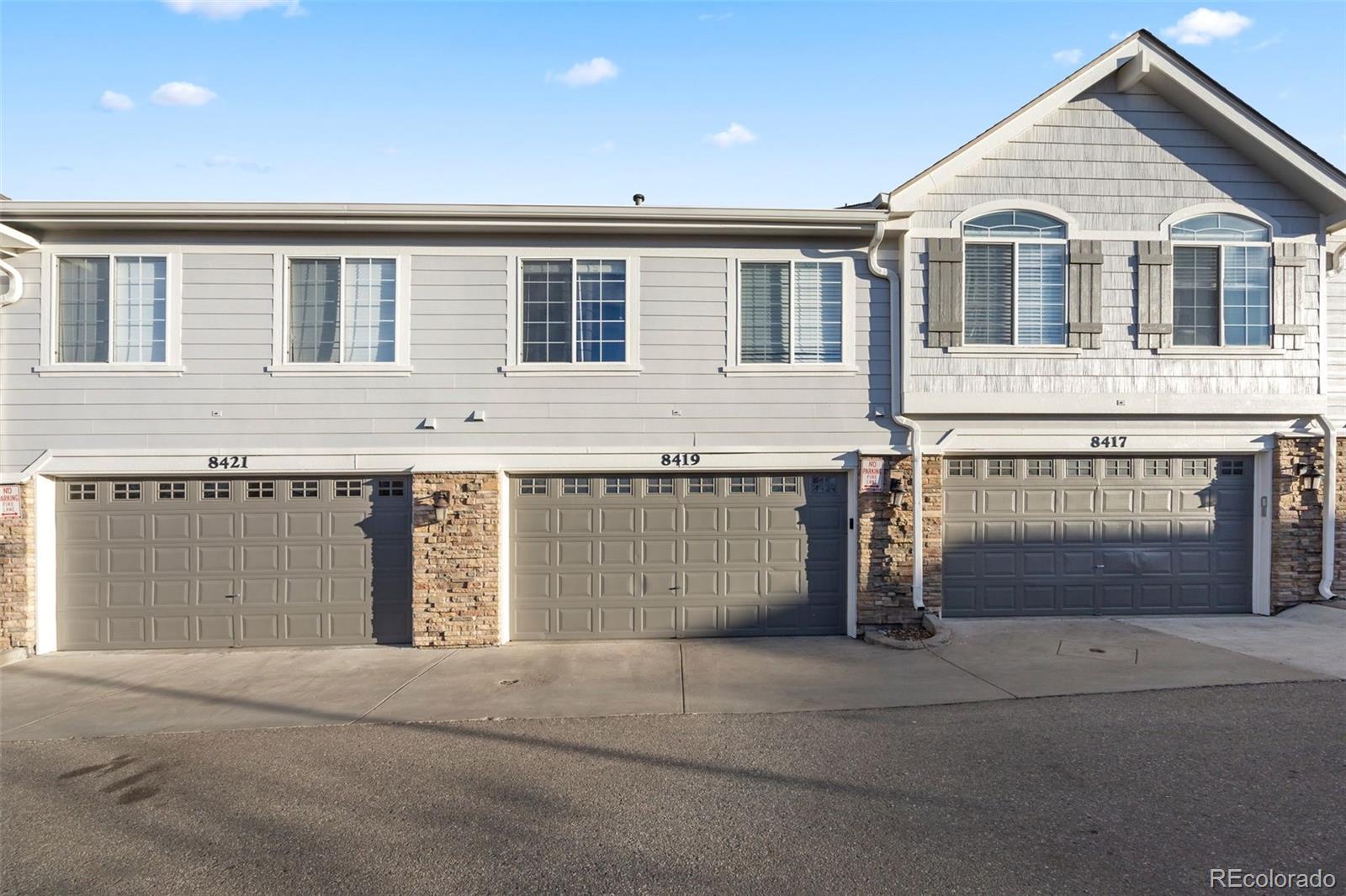 8419 Stonybridge Circle Highlands Ranch, CO 80126 - Photo 21 of 24 a front view of a house with a garage